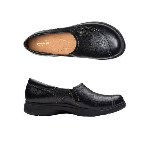 Top and profile view Certina Ease loafer in black leather with elastic with silver button and a solid, durable design black rubber outsole. Detailed light stitching used. Beige footbed with gold Clarks logo at heel.