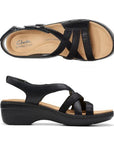 Top and profile view of Merliah Bonita sandal in black. Footbed is beige with Clarks branding, thick rubber outsole is black. 