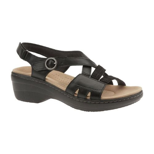 Merliah Bonita sandal in black. Black leather upper with adjustable straps across instep and around ankle. Features silver hardware and grey stitching around footbed. 