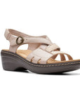 Merliah Bonita sandal in sand. Beige leather upper with adjustable straps across instep and around ankle. Features bronze hardware and beige stitching around footbed. 