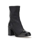 Mjus Black heeled ankle boot with green patent toe cap and heel detail.