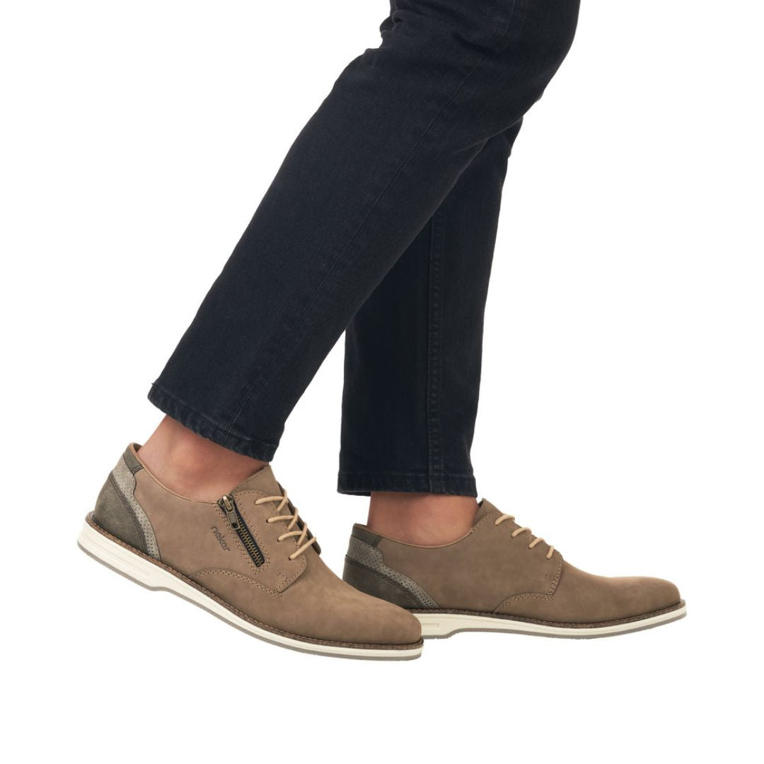 12505 Semi-Dress Shoe in brown leather with side zipper, shown worn with black jeans, featuring a comfortable toe box design, lace-up closure, and lightweight rubber outsole for versatile casual wear