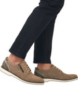 12505 Semi-Dress Shoe in brown leather with side zipper, shown worn with black jeans, featuring a comfortable toe box design, lace-up closure, and lightweight rubber outsole for versatile casual wear