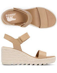 A pair of Sorels Cameron Wedge Sandal: Tan leather, adjustable strap, woven platform.