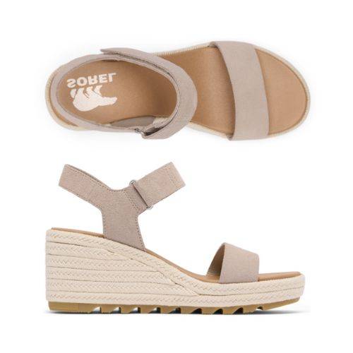 A pair of Sorel Cameron wedge sandals in beige leather with adjustable ankle straps and textured soles.