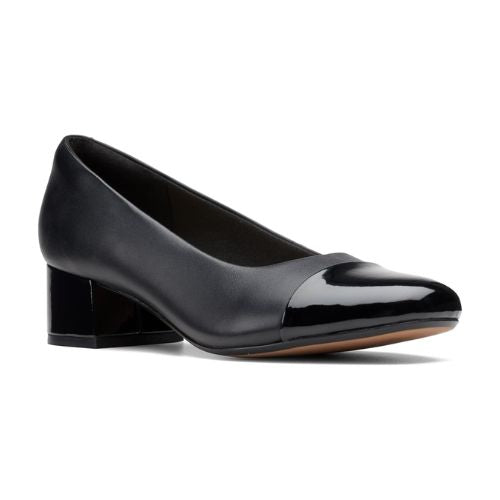 Black pump with patent toe cap and patent block heel.