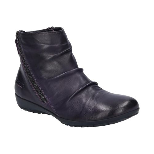 Deep Purple leather ankle boot with a ruched upper and a black outsole. Diagonal zipper closure on each side. 
