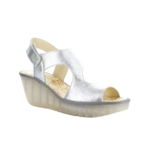 Yoxa Wedge Sandal in metallic silver with Velcro strap, 2.5-inch wedge heel, and cushioned floral-patterned insole.