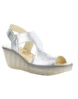 Yoxa Wedge Sandal in metallic silver with Velcro strap, 2.5-inch wedge heel, and cushioned floral-patterned insole.