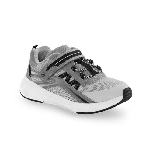 Gray and black athletic sneaker with white sole, adjustable Velcro strap, and comfortable memory foam footbed.