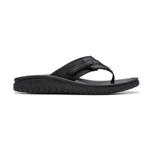 Black  leather thong sandal with fabric toe post and adjustable strap. 