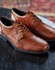 Brown leather dress shoe with bicycle toe.