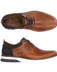 14405 Slip-On Lace Sneaker in rich cognac brown leather with navy blue accents, featuring a sleek casual design, contrasting white midsole, and navy laces. Top and side view showing classic derby-style construction and comfortable rubber outsole.