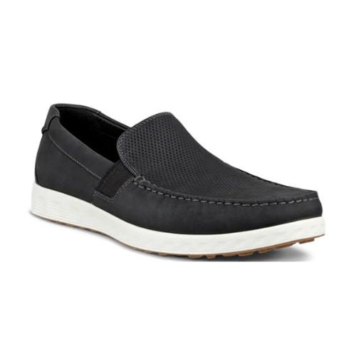 An Ecco black nubuck slip-on with a white midsole. Upper has perforations and apron stitching. 