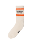 White bamboo crew sock with orange and black stripes, featuring the text 'Don't Kale My Vibe' in bold. Eco-friendly and plant-based design.