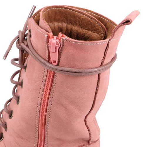 Closeup of the Phebe combat boot, showing inside zipper and wrap around lace feature. 