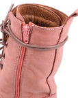 Closeup of the Phebe combat boot, showing inside zipper and wrap around lace feature. 