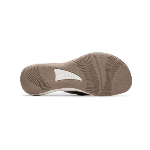 Bronze outsole of Breeze opal thong sandal with white Clarks logo in triangle and wave design tred