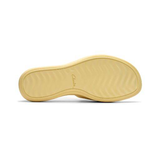 Wavy texture outsole in yellow EVA on Drift slide sandal. Clarks logo stamped in middle