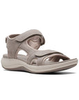 Stone color walking sandal with Velcro on heel, toe and ankle strapes. Light beige thick midsole and darker beige rocker rubber outsole