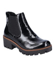 Black patent Chelsea boot with chunky, shock-absorbing sole and elastic side panels.