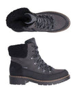 A pair of A Rieker black leather ankle boot with fabric cuff, tan accent stitching at midsole and rugged black outsole.