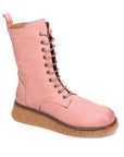 A light pink nubuck lace up boot with a tan crepe outsole. 