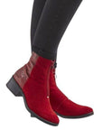 Model wearing Bos & Co Jordon Zip Ankle Boot in red suede, showcasing its stylish zip closure and low block heel for versatile wear.