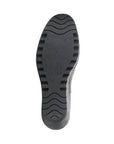 Bottom sole view of FLY London Yade Wedge Boot showcasing its textured black outsole for grip and stability.