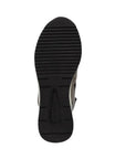 Black outsole of the wedge sneaker showing tread lines and Remonte logo at heel