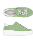 Pair of Remonte green platform sneakers with side zipper, blue/green/yellow abstract design laces, grey logo'd footbed, white heel cap and white platform outsole.