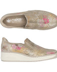 Pair of gold scale pattern Rieker slip on shoe with dark pink and gold peek through colors, beige logo'd footbed white midsole and beige outsole.