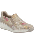 Gold scale pattern Rieker slip on shoe with dark pink and gold peek through colors, white midsole and beige outsole.