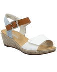 Rieker sling back wedge with blue back strap, brown buckle strap, white velcro toe strap, beige logo'd footbed and tan textured midsole.