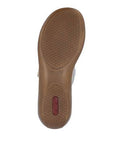 Brown outsole with hexagon pattern tread and red Rieker logo on heel.