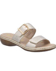 Rieker gold two Velcro strap slide sandal with gold buckle detail, beige logo'd footbed, beige midsole and brown outsole.