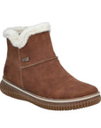 Brown ankle boot with white V-cut fur lining at the cuff, T-stitching accent in light tan thick thread. RiekerTex metal tab on side and Rieker logo on heel. Thick treaded tan outsole with thin white mid-sole.