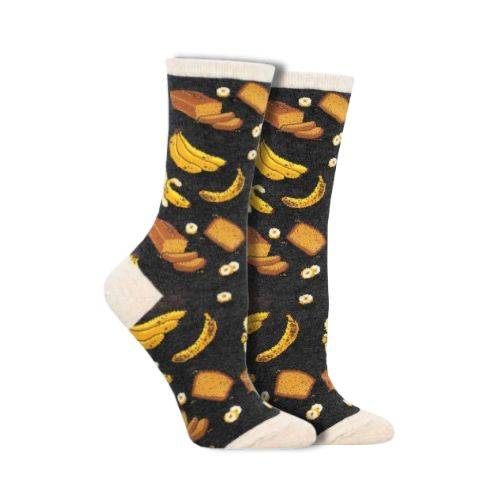 Socksmith Women&#39;s Banana Bread Socks featuring a black background with banana and bread patterns. Available at White-Balmer Shoes.