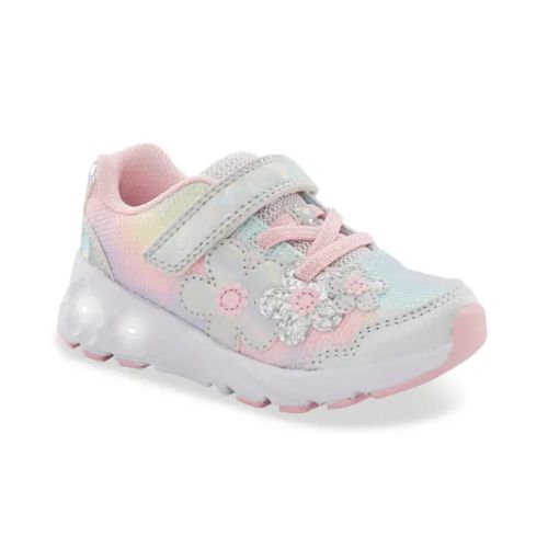 Rainbow childrens sneaker with pastel tie-dye, floral accents, a pink sole, memory foam footbed, and a Velcro strap.