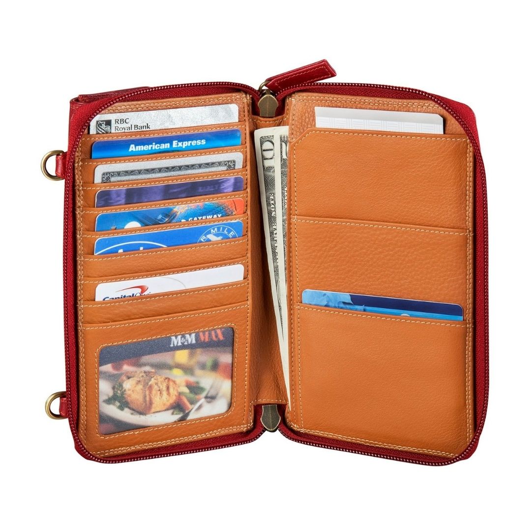 Interior of the small organizer in red. Lining is tan leather. Features many card slots, an ID window, and slip pockets for cash. 