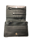 Interior of black leather purse, showing secured card slots, two zippered pockets, pen holder, and two slip pockets.