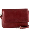 Half flap crossbody bag in red. Reddish-brown leather purse with a detachable shoulder strap.