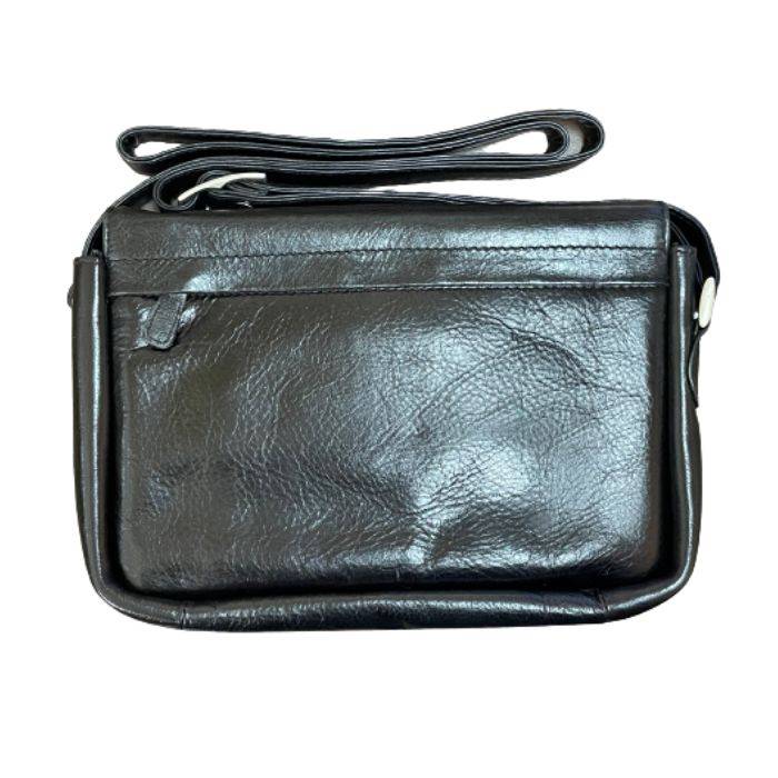 Rear exterior of black leather organizer bag, featuring a zippered pocket. 