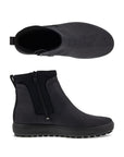 A pair of Ecco black nubuck ankle boots with textile side paneling and a black outsole. 