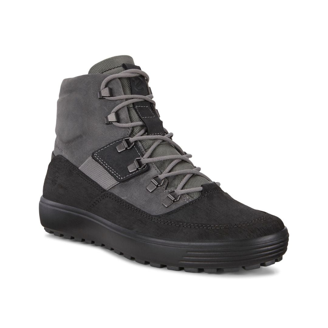 An Ecco sneaker boot with two tone leather uppers, grey laces, and a black outsole. 