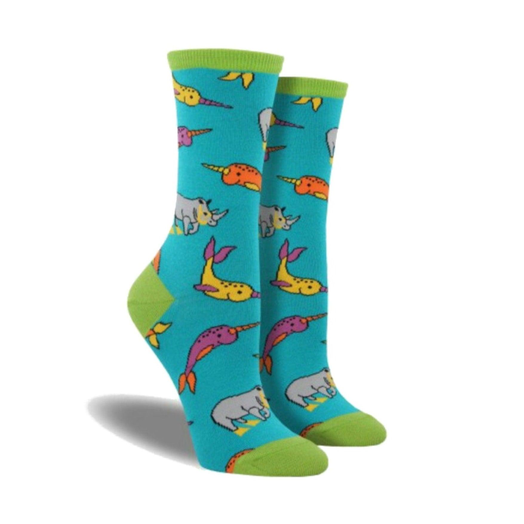 Blue socks with green accents featuring scuba diving rhinos and narwhals