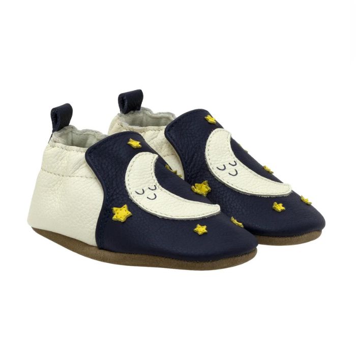 Navy and cream leather baby shoes with moon and star design.