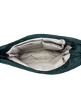 Inside view of Travelon's Anti-Theft hobo bag in teal with beige lining.