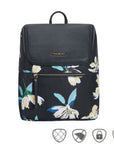 Black backpack with floral pattern. Has gold horizontal zipper on front.