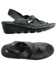 A pair of black Bernie Mev Lihi Brighten sandals with woven elastic upper, a heel strap, an open toe, logo'd black footbed and a black wedge outsole.